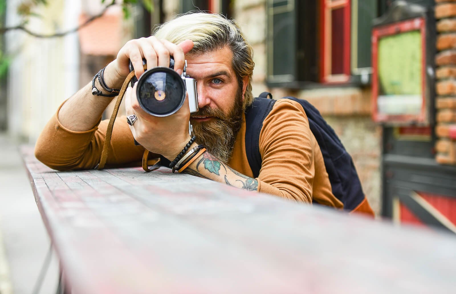 A man holding a camera to his vision while resting on a railing. An anxiety disorder specialist in Portland, OR can help you discover ways to bring you joy. Reach out today to get started.