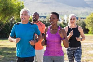 A group of older diverse individuals running in a group of 4. Representing how moving your body can help with hormone imbalance & anxiety. Get started with an anxiety therapist in Portland, OR today to learn more strategies. 