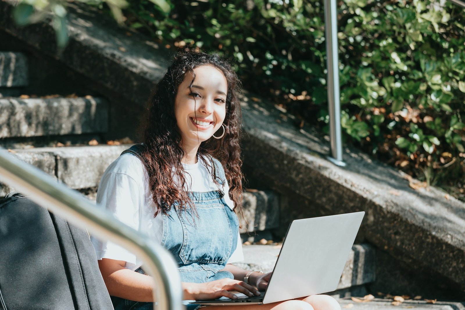 young woman holding a laptop