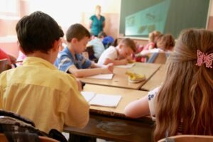 A school classroom filled with students working. If your child strugles with separation anxiety, we can help. Our anxiety therapists in Portland, OR are here to support your family. 