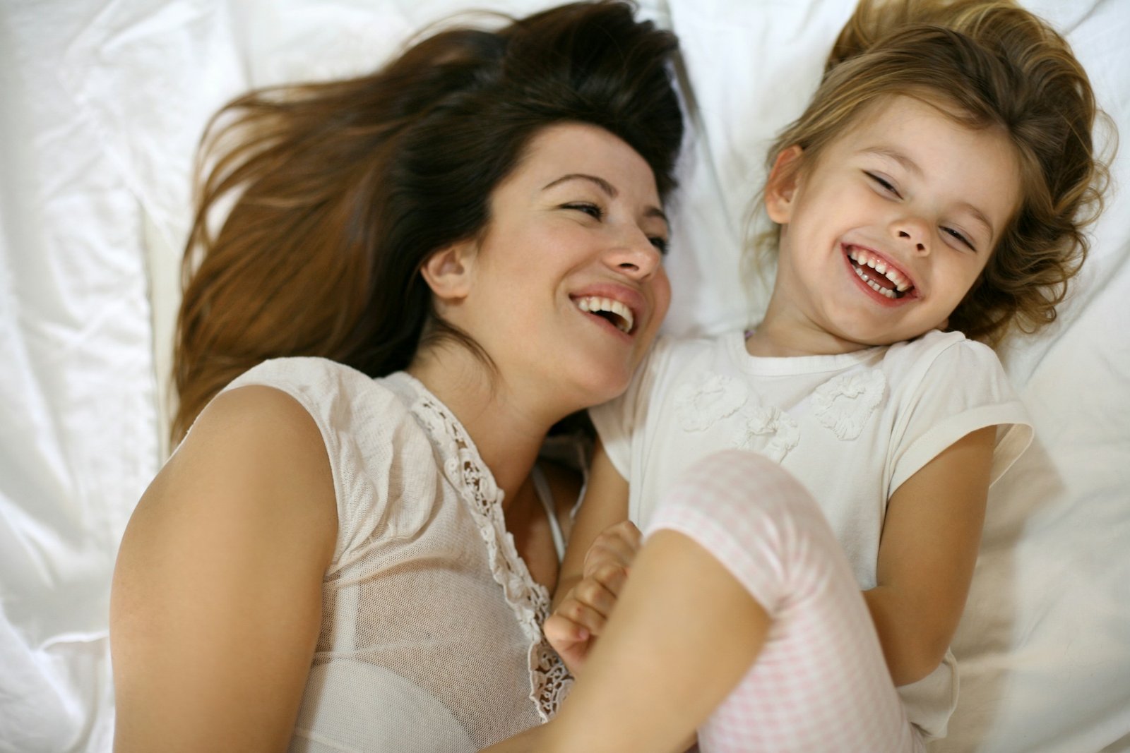 mother and child in bed