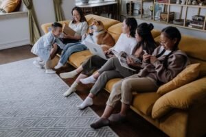 Multigenerational family spending quality time together on a couch, representing emotional support and connection for mental health care in Portland, Oregon.