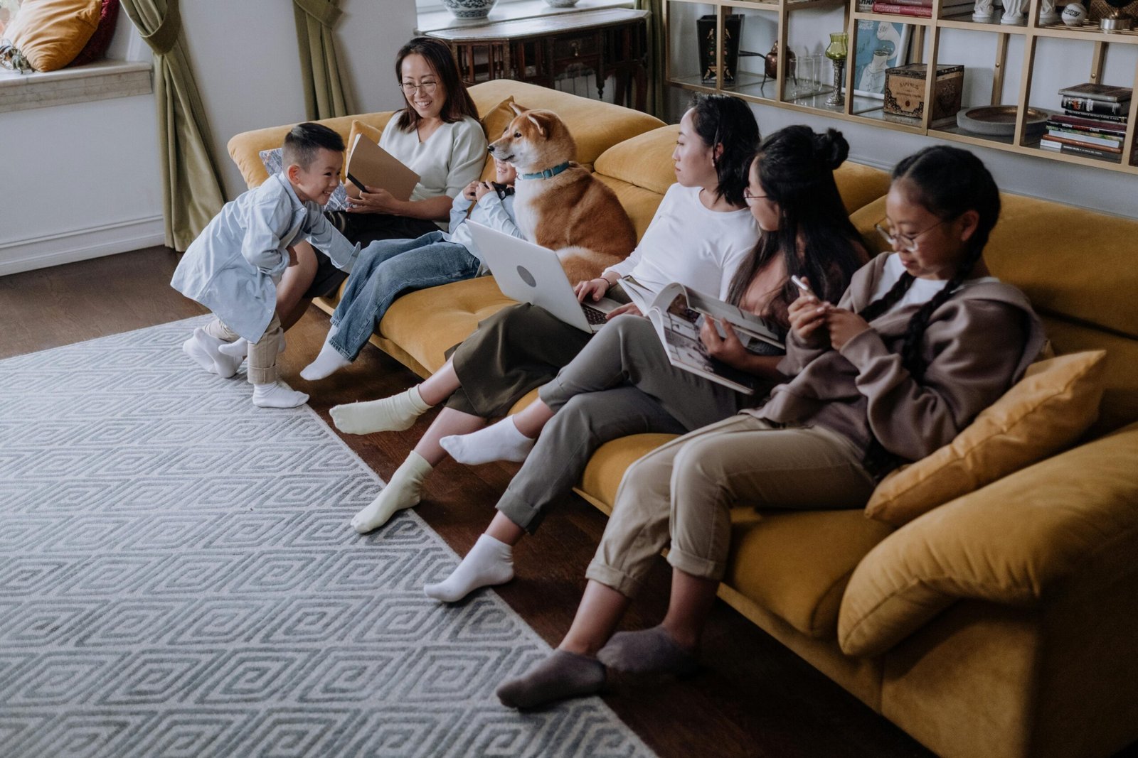 Multigenerational family spending quality time together on a couch, representing emotional support and connection for mental health care in Portland, Oregon.