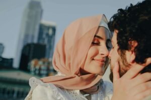 A happy cross-cultural couple holding each other closely with passion. If a trauma bond is holding you back, discover how trauma counseling in Portland, OR can help you. Reach out today to start your healing journey. 