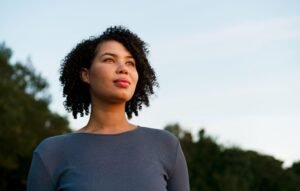 woman happily looking beyond
